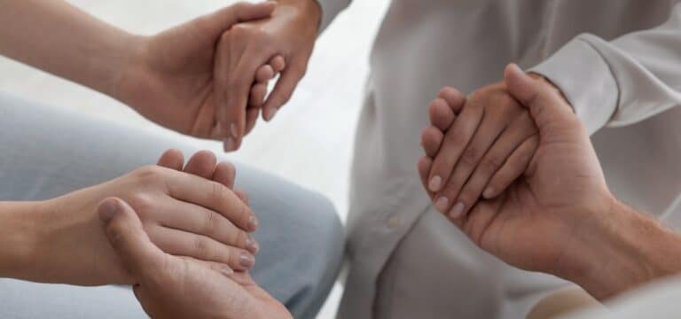eating disorder treatment options - people holding hands