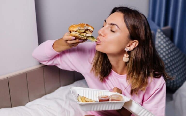 Binge eating and purging disorder - lady eating burger