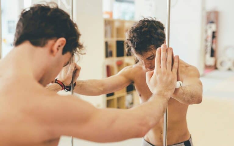 anorexia with men - man leaning against mirror