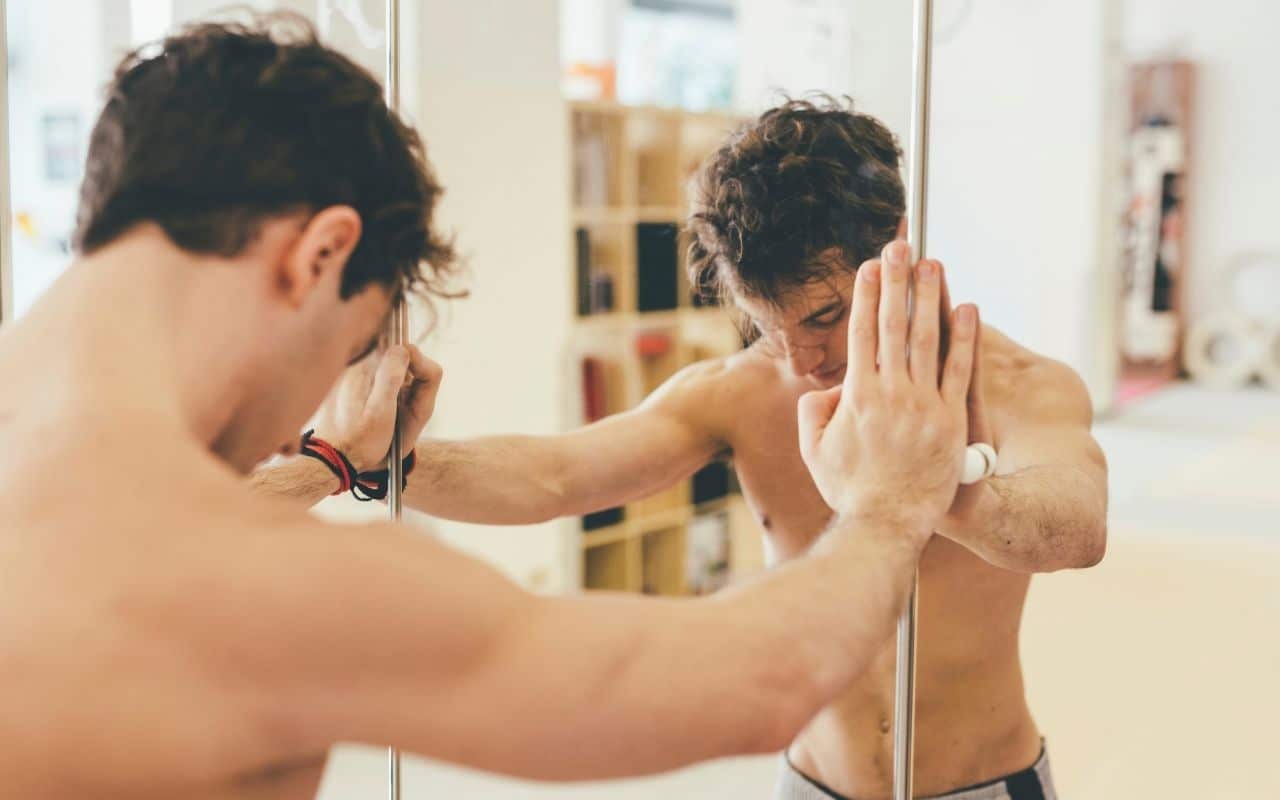 anorexia with men - man leaning against mirror