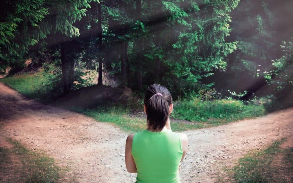 outpatient vs inpatient eating disorder treatment - woman deciding between 2 paths